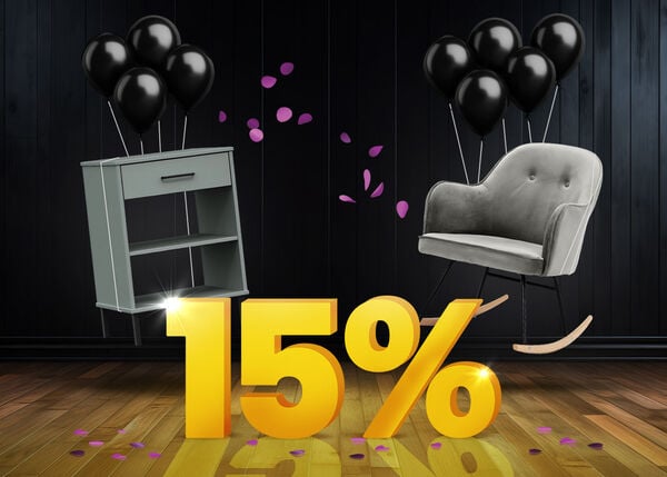 Grey side table and grey rocking chair with black balloons in front of a bright yellow 15% sign on a dark wooden floor.