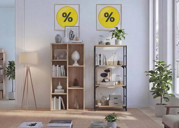 Modern living room with open shelving units, wooden bookcases, decorative storage boxes, indoor plants, and a floor lamp, styled with minimalist d&eacute;cor and framed percentage discount signs on the wall.