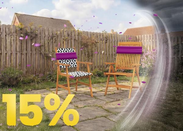 Wooden outdoor garden chairs on a sunny patio with decorative cushions, set against a wooden fence and flowers, featuring a 15% spring promotion banner.