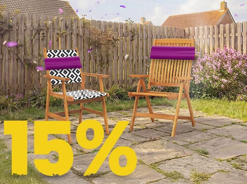 Wooden outdoor garden chairs on a sunny patio with decorative cushions, set against a wooden fence and flowers, featuring a 15% spring promotion banner.