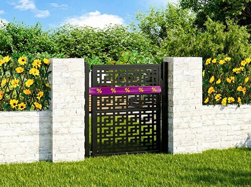 Black metal garden gate wrapped in purple-yellow discount ribbon, framed by white concrete fence with flowers and greenery behind. Click to see the products in the offer.
