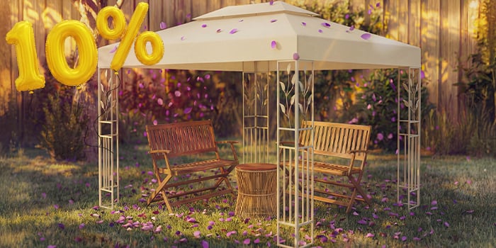 Garden gazebo with two wooden benches and a small table underneath, surrounded by pink confetti and golden 10% discount balloons, highlighting a seasonal offer on gazebos and garden canopies.
