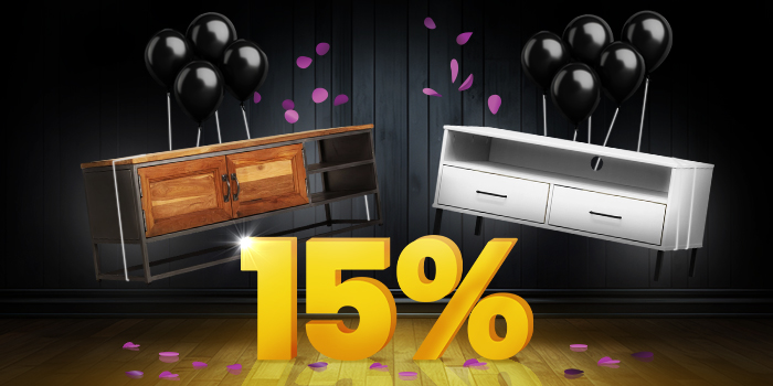 Wood and metal TV console and white TV console with black balloons in front of a bright yellow 15% sign on a dark wooden floor.